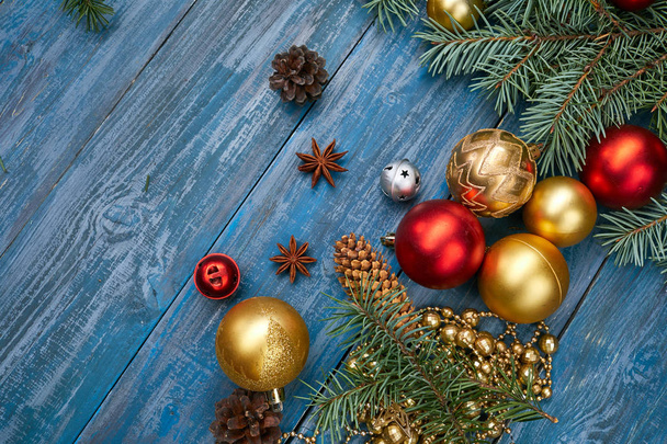 Christmas decorations with fir branches on wood board - Фото, зображення