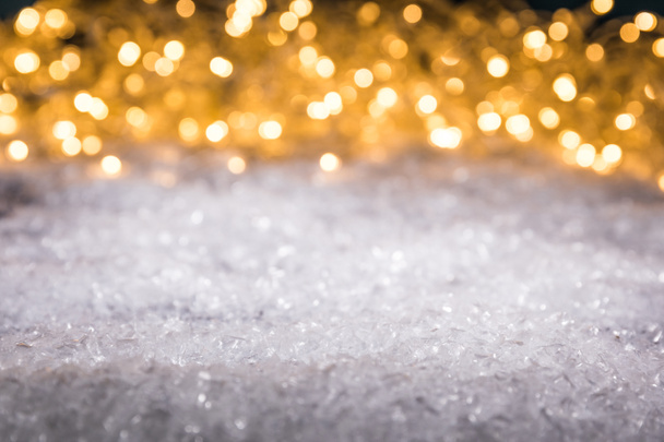 christmas winter background with snow and shiny blurred lights - Photo, Image