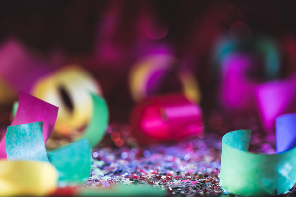 christmas confetti and shiny stars with blurred background - Фото, изображение