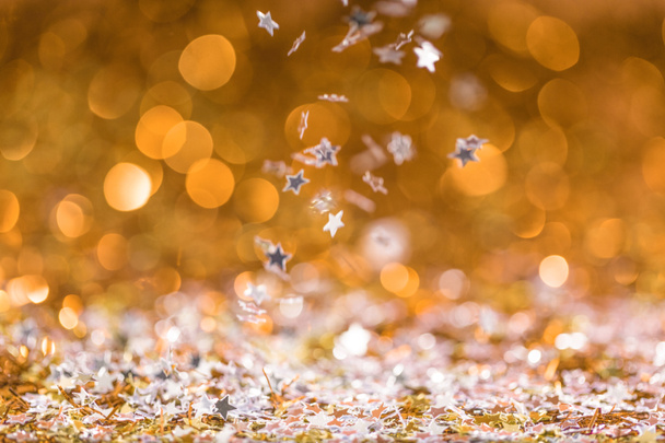 christmas texture with falling golden and silver shiny confetti stars with bokeh - Photo, Image