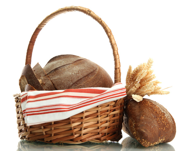 tasty rye breads with ears in basket, isolated on white - Photo, Image