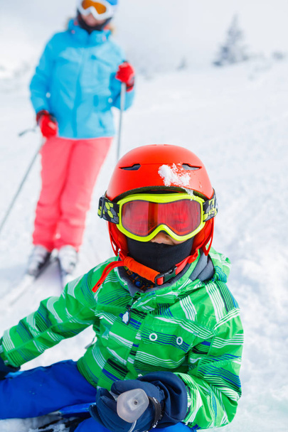 Skier boy in a winter ski resort. - Фото, зображення