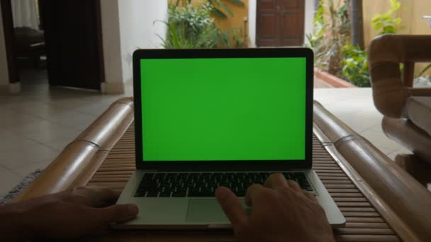 Man use laptop at home with Green Screen. Freelancer works at home. - Imágenes, Vídeo