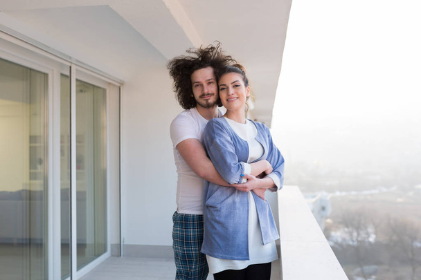 Couple hugging on the balcony - Photo, image