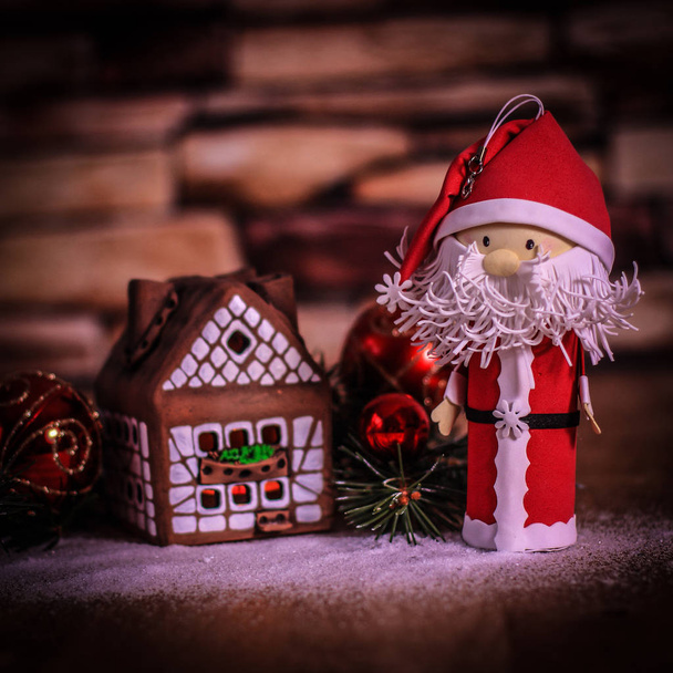 gingerbread house,Christmas balls and Santa Claus. the concept - Фото, зображення