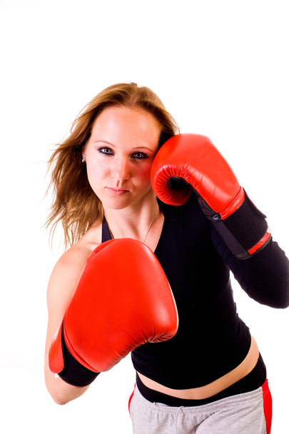 Attractive Caucasian girl practicing boxing, isolated on white background - Valokuva, kuva
