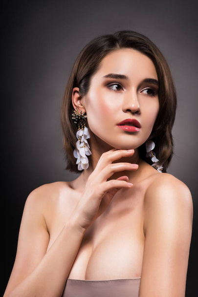 Beautiful mixed asian-caucasian race girl wearing earrings - Φωτογραφία, εικόνα