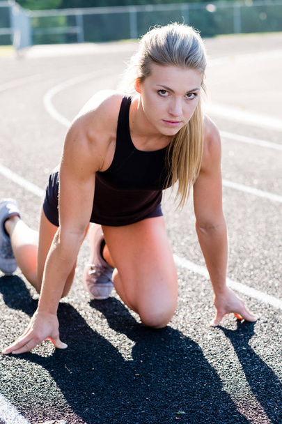Young Female Athlete Working Out on Track - Fotoğraf, Görsel