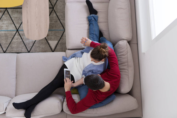 couple relaxing at  home with tablet computers - Foto, afbeelding