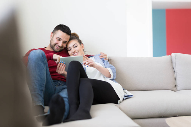 couple relaxing at  home with tablet computers - Foto, Imagen