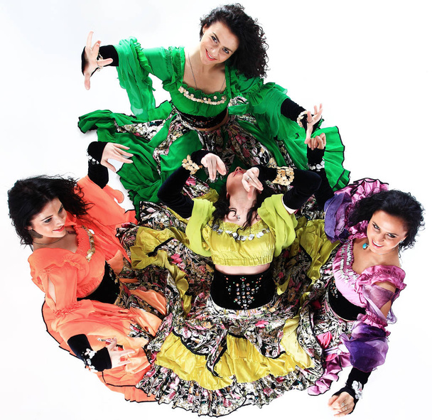 professional Gypsy dancing group in national costumes performing folk dance. - Фото, зображення