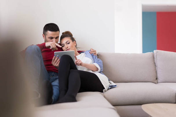 couple relaxing at  home with tablet computers - Foto, Bild