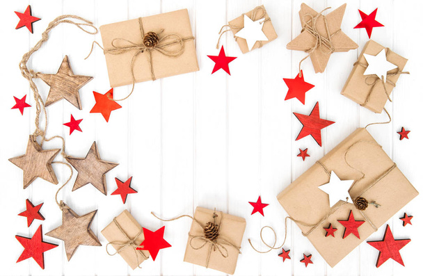 Holidays flat lay Wrapped gifts red stars decoration - Foto, Bild