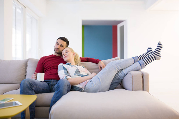 couple hugging and relaxing on sofa - Foto, Imagem