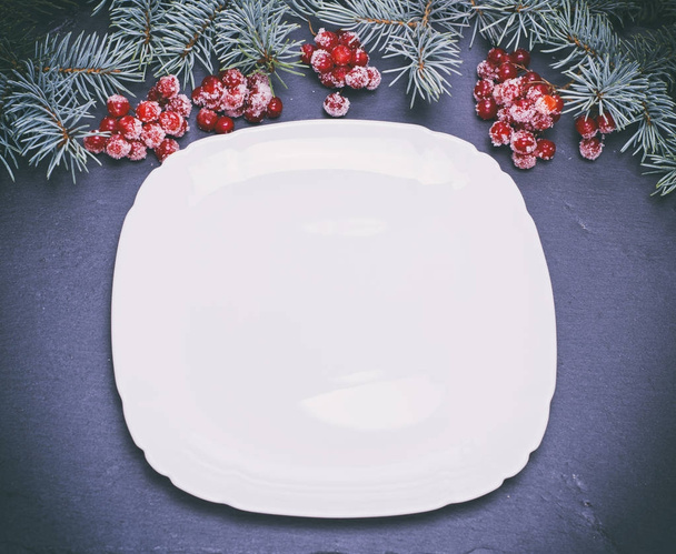 an empty white square plate on a black background - Photo, Image