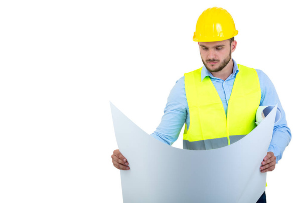 Young Engineer portrait holding blueprints isolated on white - 写真・画像