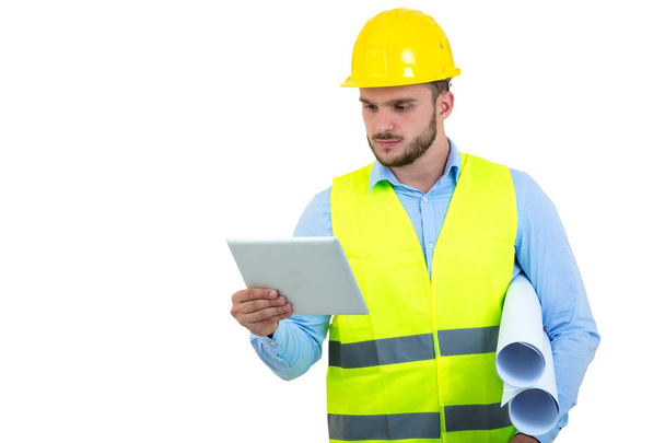 Handsome engineer working with a tablet pc, isolated on white - Foto, Bild