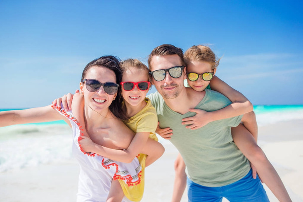 Portrait of beautiful family on the beach vacation - Photo, Image