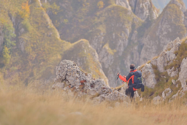 Tourist with backpacks on a mountain trail - Valokuva, kuva