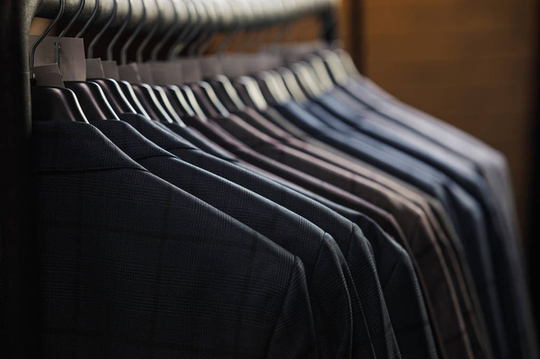 Rows of mens suit jackets in suitshop - Photo, Image