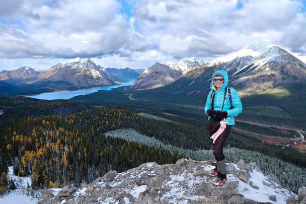 Middle age woman on mountain top hiking in Canadian Rockies.  - Photo, Image