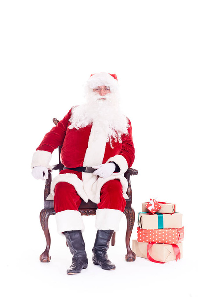 Père Noël dans la chaise
 - Photo, image