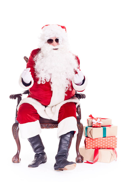 Swaggy Santa relaxing in chair - Photo, Image