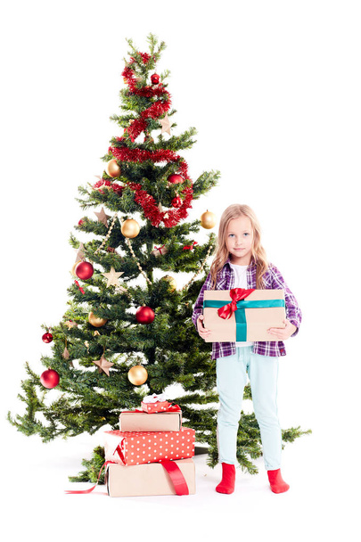 Girl near Christmas tree - 写真・画像