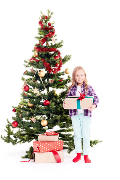 Girl near Christmas tree - Foto, Imagen