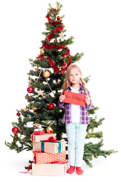 Girl near Christmas tree - Fotó, kép