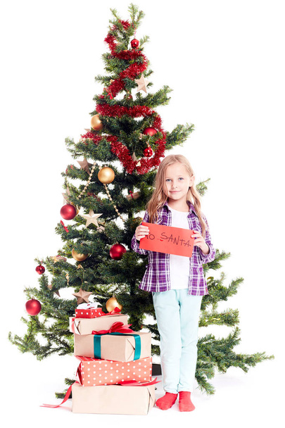 Girl near Christmas tree - Zdjęcie, obraz