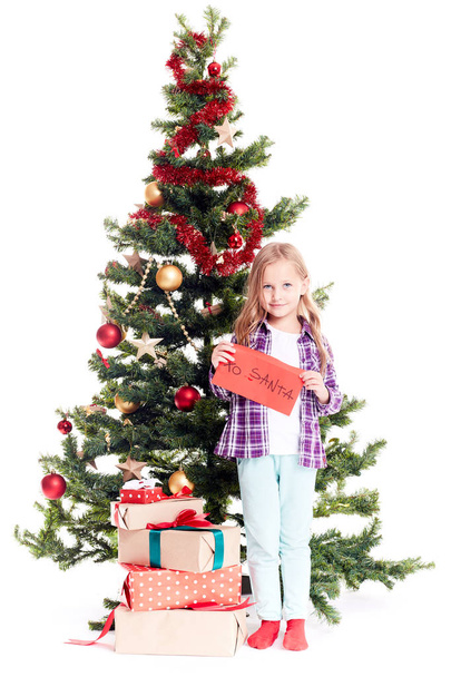Girl near Christmas tree - Foto, immagini