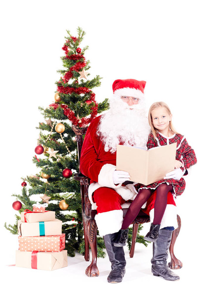 Santa reading story for cute girl - Foto, Imagem