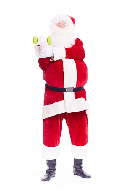 Santa Claus doing dumbbell exercise - Fotografie, Obrázek