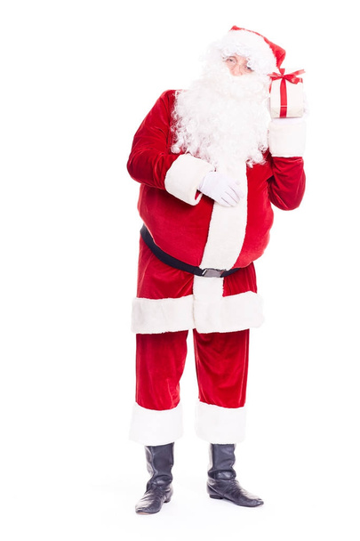 Santa Claus with Christmas present - Foto, Bild