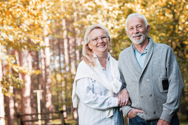Happy senior couple walking   outdoors in nature - Φωτογραφία, εικόνα