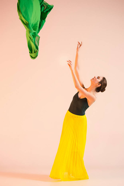 Young and incredibly beautiful ballerina is dancing at studio - Foto, Imagem
