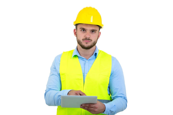 Handsome engineer working with a tablet pc, isolated on white - Valokuva, kuva