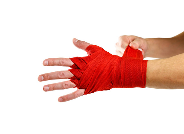 Pulls on the red Boxing on hand bandages. Knots on hands sports  - Фото, изображение