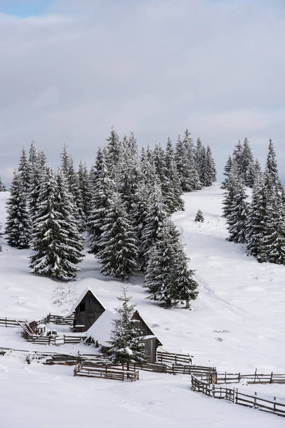Snow covered mountain wooden hut - Fotó, kép