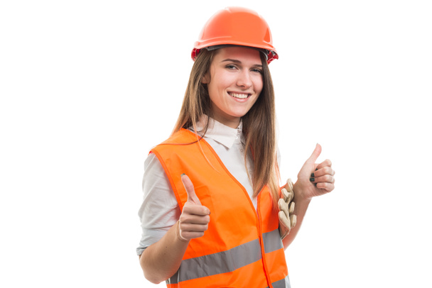 Menina construtor profissional feliz com ambos os polegares para cima
 - Foto, Imagem