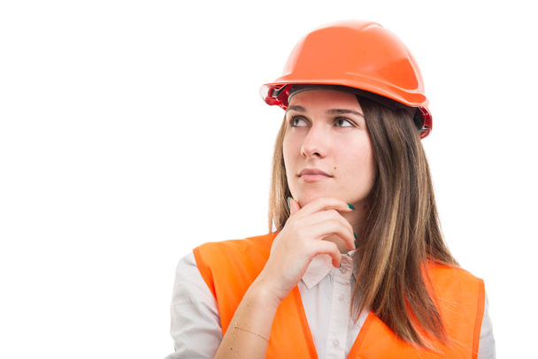 Portrait of pensive female construction or engineer - Foto, afbeelding