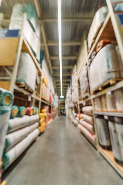 blurred view of shelves with boxes in storehouse - 写真・画像