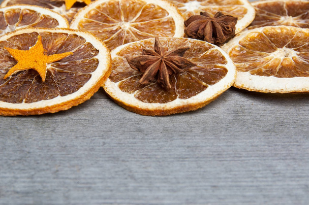 Dried orange on old wooden background - Foto, afbeelding