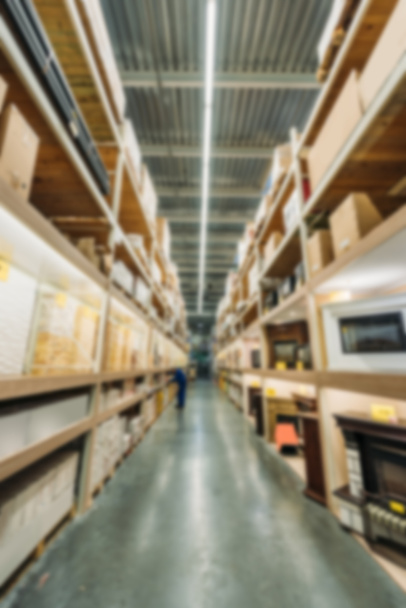 blurred view of shelves with boxes in shipping stock - Fotó, kép