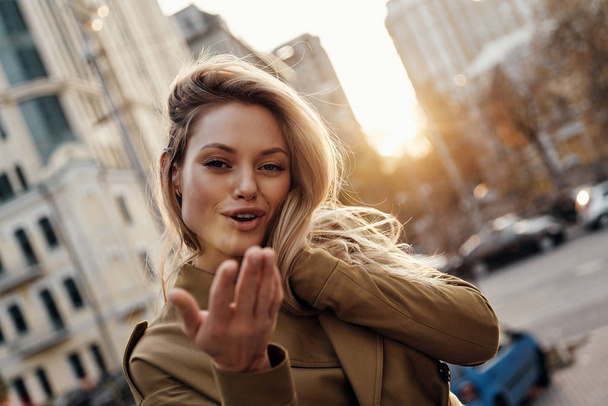 gorgeous blonde woman in city, autumn season and sunset - Photo, image