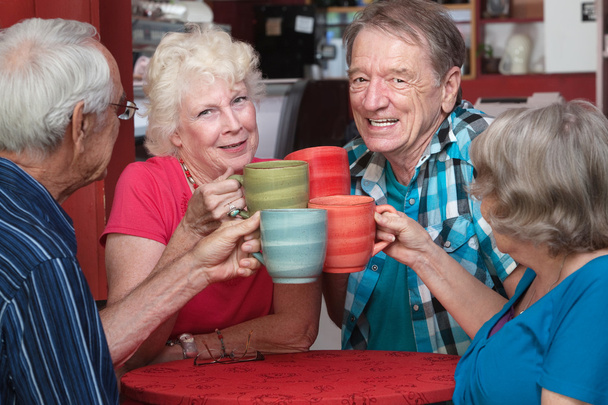 Senior Adults Toasting with Mugs - 写真・画像
