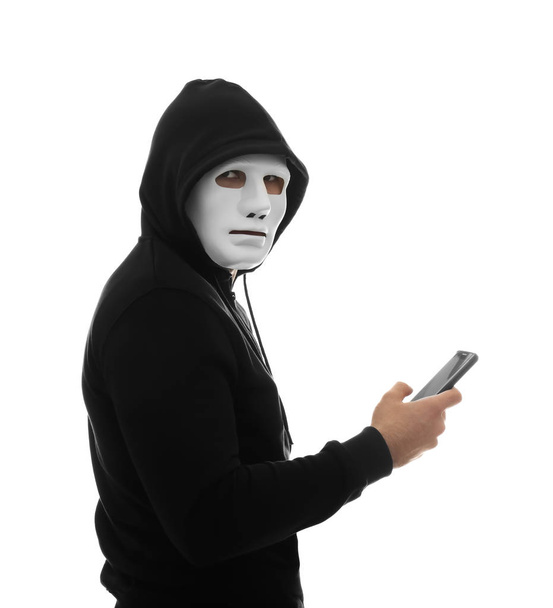 Hacker with phone on white background - Фото, зображення