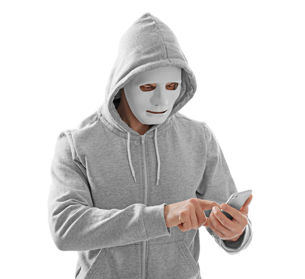 Professional hacker with phone on white background - Foto, Imagem