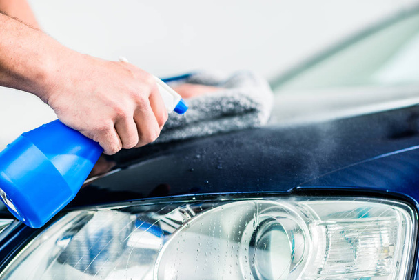 Male hands cleaning car - 写真・画像